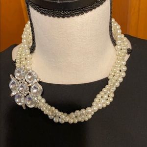 Three strand pearl necklace with rhinestone brooch